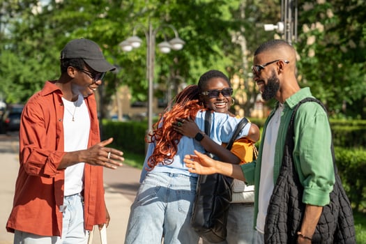 Happy bunch of friends students share smiles hugs handshakes come together to hang out enjoy company photo