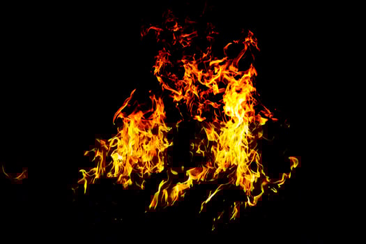 Fire flame texture. Burning material backdrop. Burn effect pattern. Blaze and torch wallpaper. Heat and haze backdrop. photo