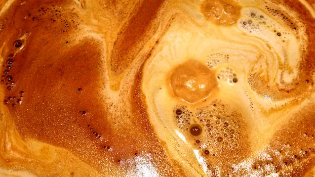 The foam of the espresso just out of the valve of the machine. photo