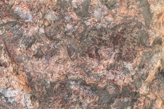 Abstract natural rock stone granite grunge rusty metal texture design background natural color stone material granite design wallpaper. Close-up detail of natural stone photo