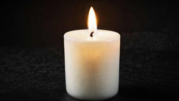 candle on black background photo