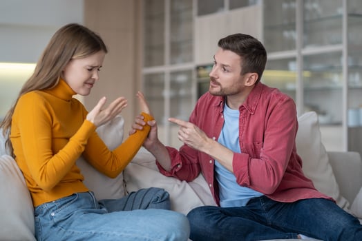 Couple, girlfriend boyfriend quarrel. Disgruntled guy scolding crying emotional woman, holding wrist photo