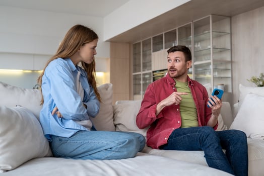 Serious quarrel between married couple, offended dissatisfied woman, awkward man making excuses. photo