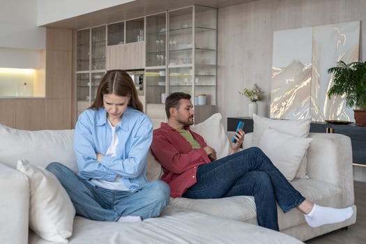 Audacious boyfriend communicates with mistress through messenger, overlooks crying, sad girlfriend photo