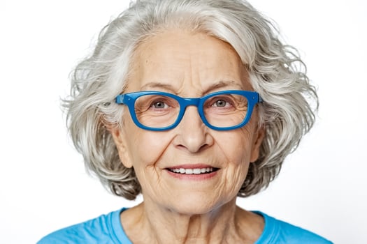 Portrait of a Happy Senior Woman with Blue Glasses photo