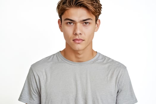 Portrait of a Serious Young Man in a Grey T-Shirt photo