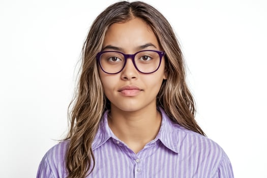 Portrait of a young woman with glasses looking at the camera photo