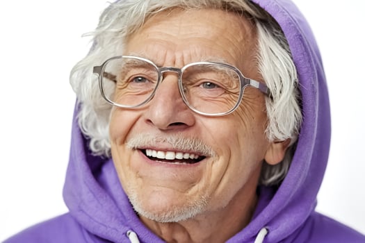 Senior Man in Purple Hoodie Smiles for the Camera photo