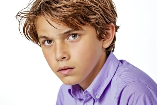 Close-up Portrait of Young Boy with Serious Expression photo