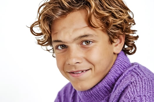 Portrait of a smiling boy with curly hair photo