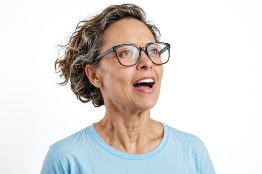 Surprised Woman in Glasses Looking Up photo