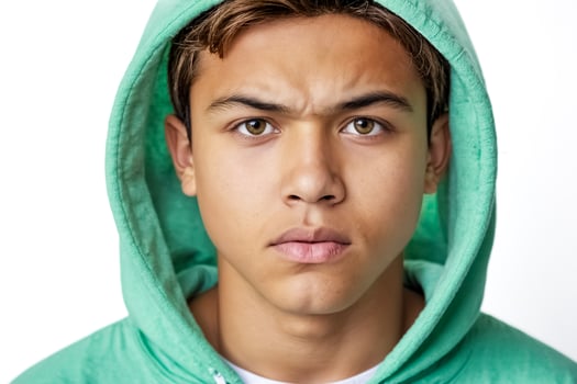 Serious Young Man in Green Hoodie photo
