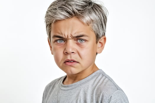 Portrait of a Young Boy with a Serious Expression photo