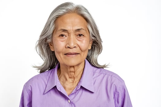 Portrait of a Senior Woman with Gray Hair Wearing a Purple Shirt photo