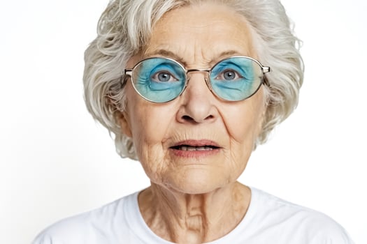 Portrait of a senior woman with glasses looking surprised photo