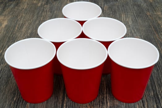 Red disposable paper cups for drinks. photo