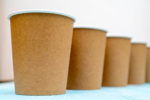 Brown disposable paper cups for drinks. photo
