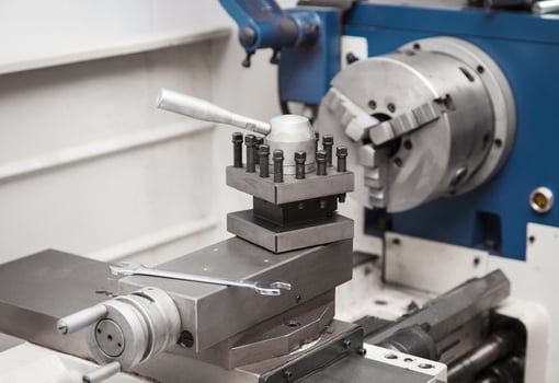 Lathe for metal processing in a workshop. A modern lathe for processing metal and other materials. photo