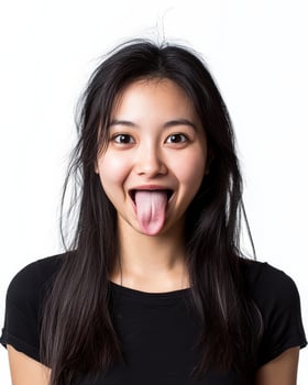 A young woman expresses delight with a playful tongue-out grin photo