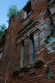 Vertical windows in an old brick building photo