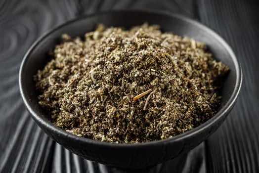 aromatic green dried sage on a black wooden rustic background photo