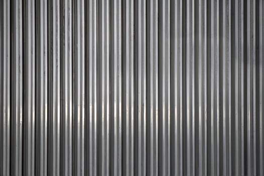 Background from unpainted corrugated metal. Vertical stripes. photo