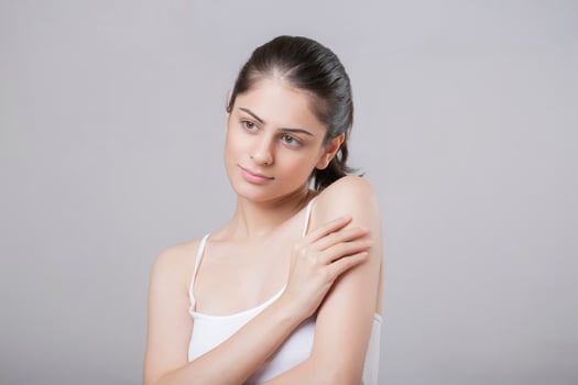 Beautiful Hot Lady Giving Side Pose With One Hand On Her Shoulder photo