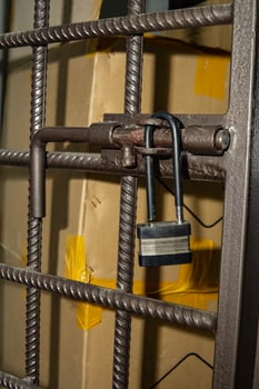 open padlock on the cage photo