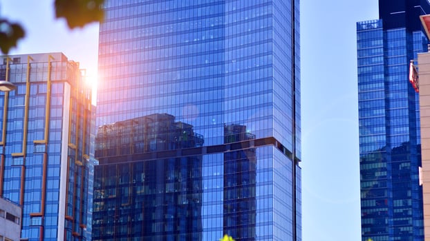 Modern sustainable glass office buildings. Exterior view of corporate headquarters glass buildings architecture.Glass windows in energy-efficient buildings. Financial business center buildings. photo