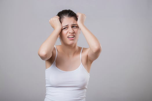 Stressed Woman Holding Head With Her Hands photo