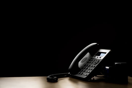 modern landline phone on the table photo