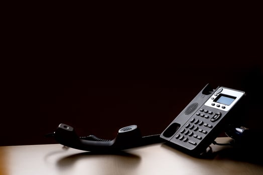modern landline phone on the table photo