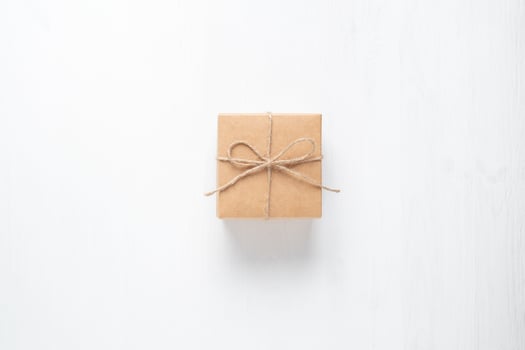 gift box tied with string on a white background photo