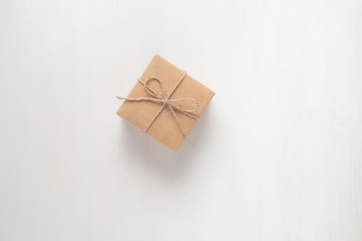 gift box tied with string on a white background photo