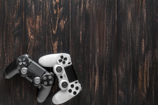 black and white modern gamepads on a dark background photo