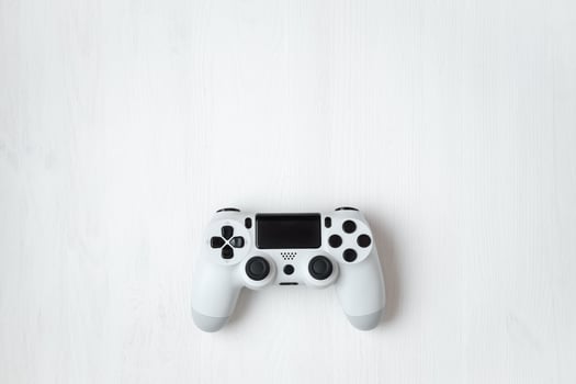 White modern gamepad on background photo