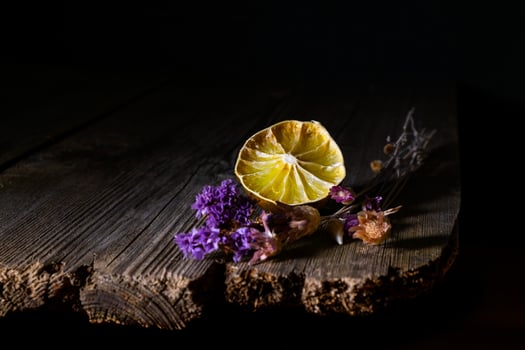 dry flowers and lemon on the old board photo