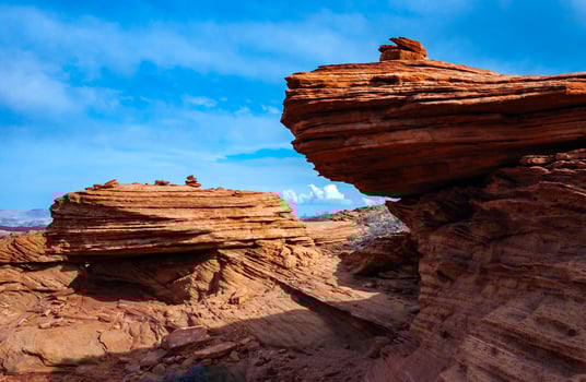 Layered weathered red sandstone rock formations photo