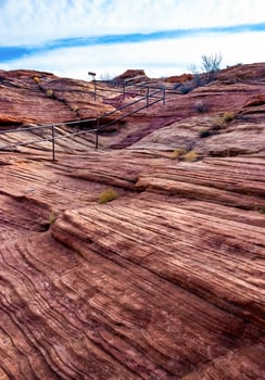 Layered weathered red sandstone rock formations photo