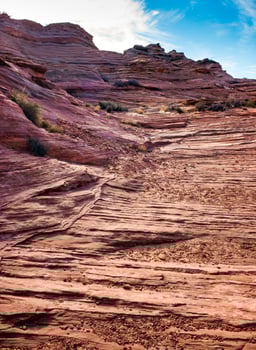 Layered weathered red sandstone rock formations photo