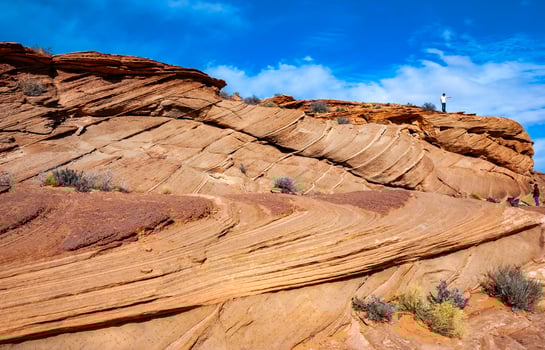 Layered weathered red sandstone rock formations photo