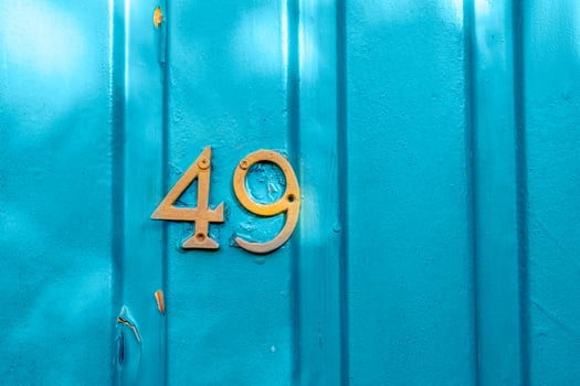 Number 49 on the blue metal wall photo