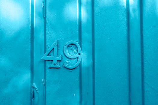 Number 49 on the blue metal wall photo