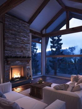 Cozy living room with fireplace and mountain view at dusk photo