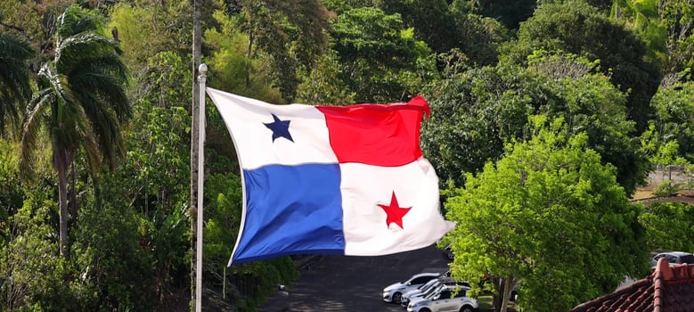 Panama Flag proudly waving in Panama Canal. photo