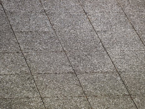 industrial style grey tiled concrete floor background photo