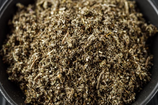 aromatic green dried sage on a black wooden rustic background photo