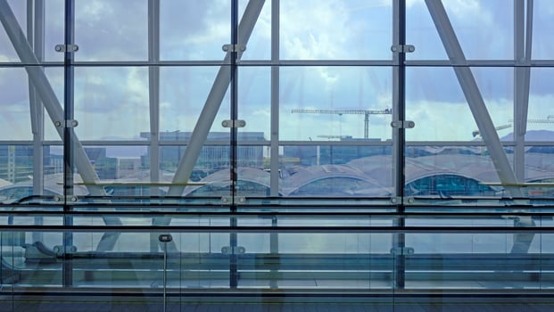 Airport building with big windows and lateral elevator photo