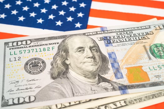 US dollar banknotes on USA America flag background, Business and finance. photo