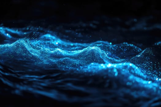 Bioluminescent plankton glow brilliantly in the dark. photo